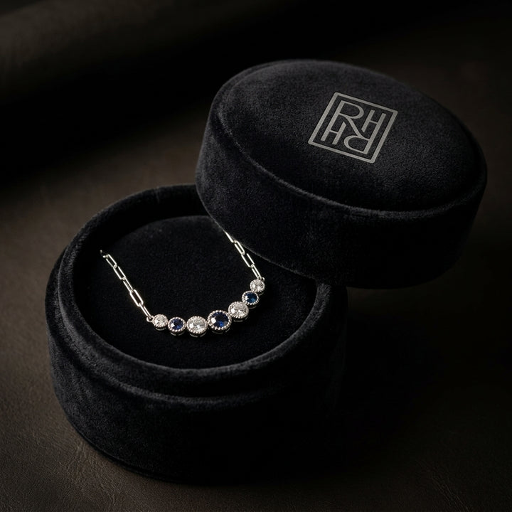 Sapphire & Diamond Graduated 7-Stone Necklace with Millgrained Edging in 14K White Gold - presentation
