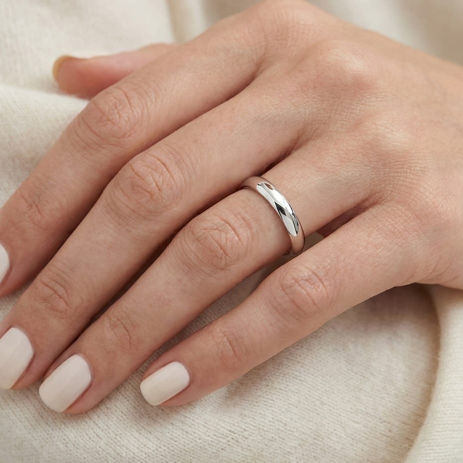 3mm Slightly Domed Traditional Oval Wedding Band in 14K White Gold, worn on hand, close-up