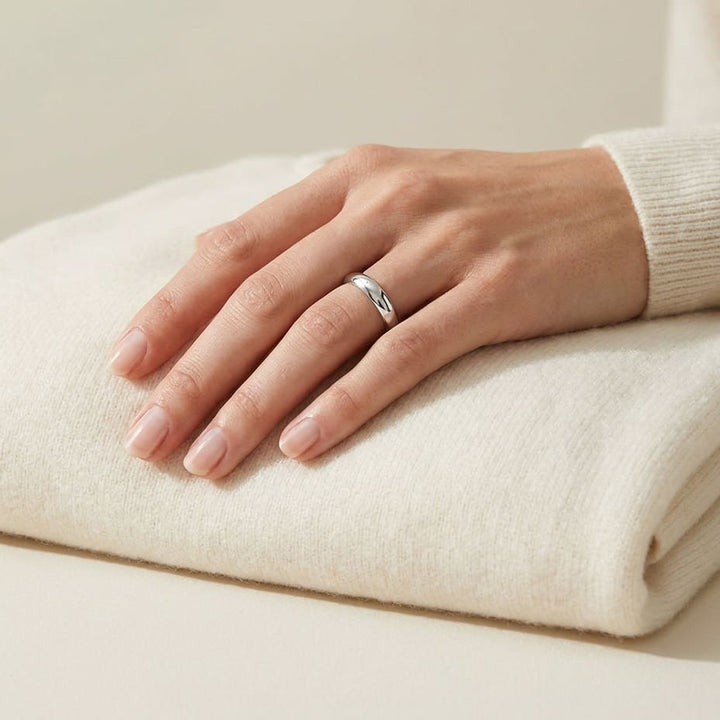 4mm Slightly Domed Traditional Oval Wedding Band in 14K White Gold, worn on hand, full view