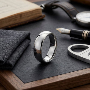 6mm Slightly Domed Traditional Oval Wedding Band in 14K White Gold, on walnut surface with pocket square