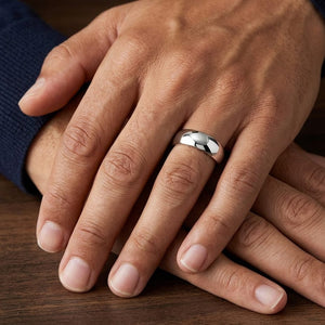 7mm Slightly Domed Traditional Oval Wedding Band in 14K White Gold, worn on hand, masculine close-up