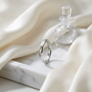 3.5mm Flat Comfort-Fit Wedding Band in 14K White Gold, on marble vanity tray with silk
