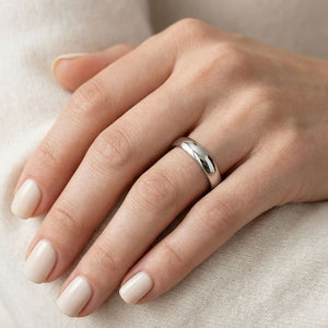 4mm Low Dome Wedding Band in 14K White Gold, worn on hand, close-up