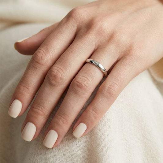 2.5mm Slightly Domed Comfort-Fit Wedding Band in 14K White Gold, worn on hand, close-up