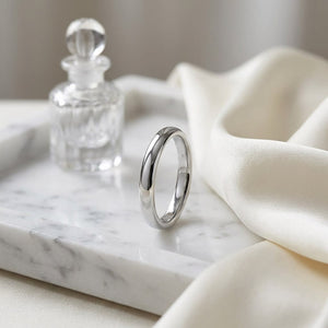 3mm Slightly Domed Comfort-Fit Wedding Band in 14K White Gold, on marble vanity tray with silk