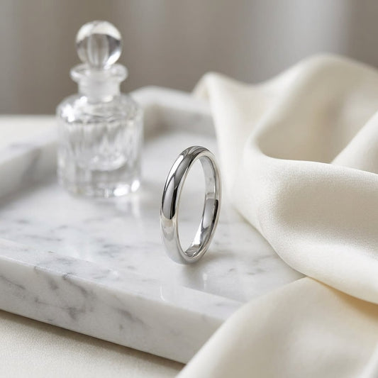 3mm Slightly Domed Comfort-Fit Wedding Band in 14K White Gold, on marble vanity tray with silk