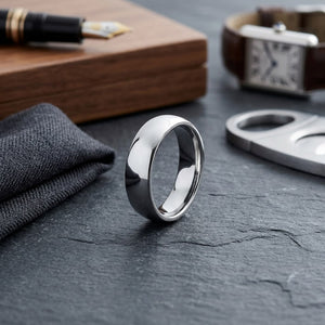 6mm Slightly Domed Comfort-Fit Wedding Band in 14K White Gold, on walnut surface with pocket square