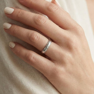 4mm Slightly Domed Super Light Milgrain Comfort-Fit Wedding Band in 14K White Gold, worn on hand, close-up