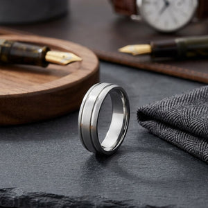 6mm Satin Finish Parallel Groove Carved Wedding Band in 14K White Gold, on walnut surface with pocket square