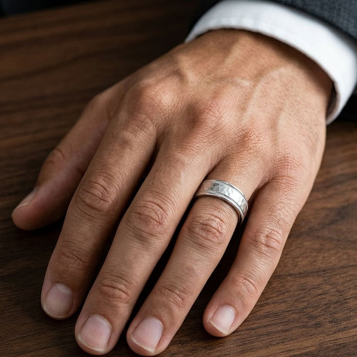 8mm Hammered Center High Polish Round Edge Carved Wedding Band in 14K White Gold, worn on hand, masculine close-up
