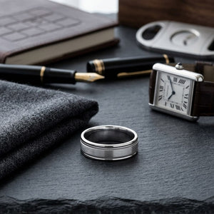 6mm Satin Finish Milgrain Round Edge Carved Wedding Band in 14K White Gold, on walnut surface with pocket square