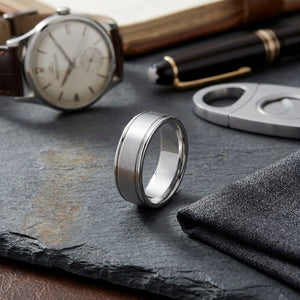7mm Satin Finish High Polished Round Edge Carved Wedding Band in 14K White Gold, on walnut surface with pocket square