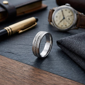 6mm Comfort-Fit Wedding Band in 14K White Gold, on walnut surface with pocket square