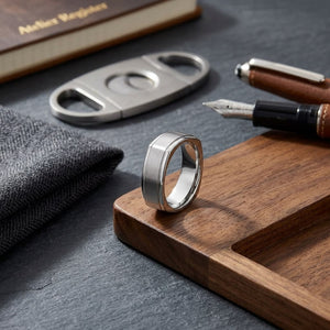 7mm Satin Finish Carved Wedding Band in 14K White Gold, on walnut surface with pocket square
