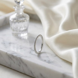 2mm Comfort-Fit Wedding Band in 14K White Gold, on marble vanity tray with silk
