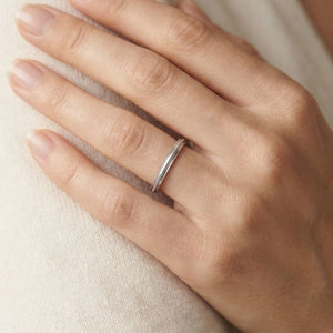 2mm High Polish Milgrain Round Edge Carved Wedding Band in 14K White Gold, worn on hand, close-up