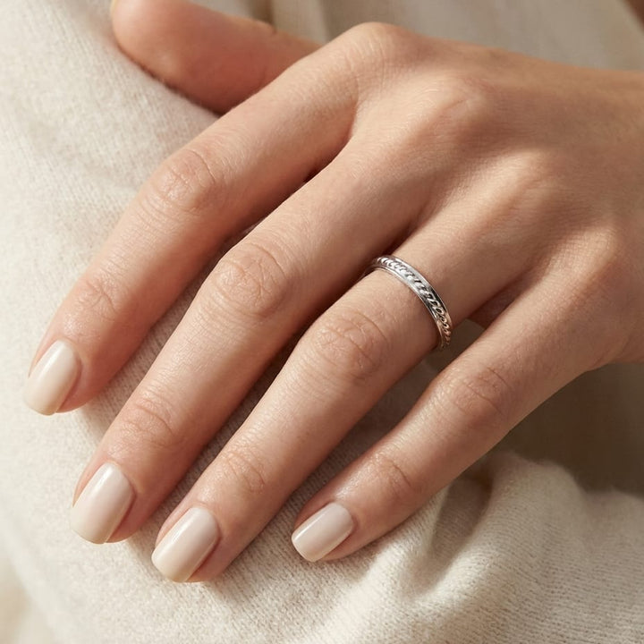 2mm High Polish Carved Wedding Band in 14K White Gold, worn on hand, close-up