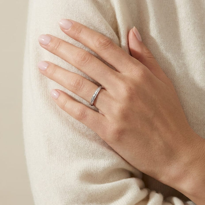 2mm High Polish Carved Wedding Band in 14K White Gold, worn on hand, full view