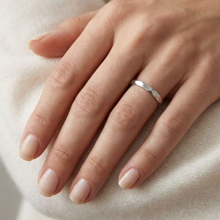 2mm High Polish Carved Wedding Band in 14K White Gold, worn on hand, close-up