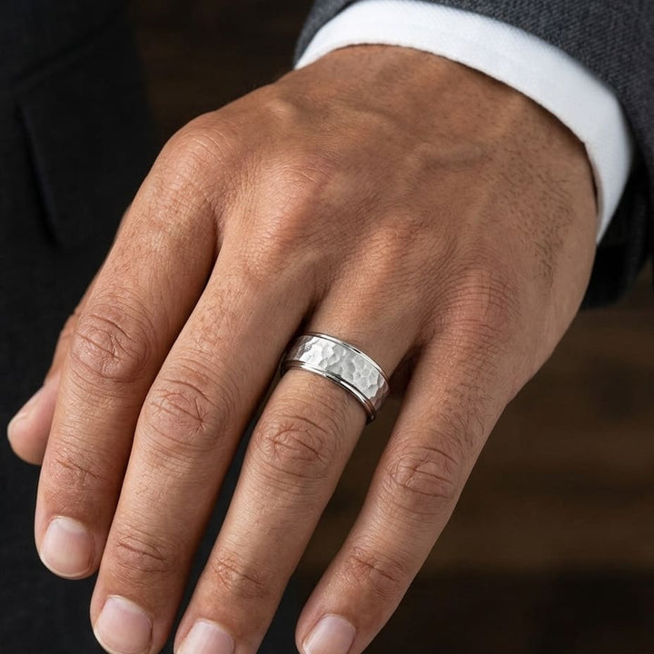 8mm Hammered Finish Carved Wedding Band in 14K White Gold, worn on hand, masculine close-up
