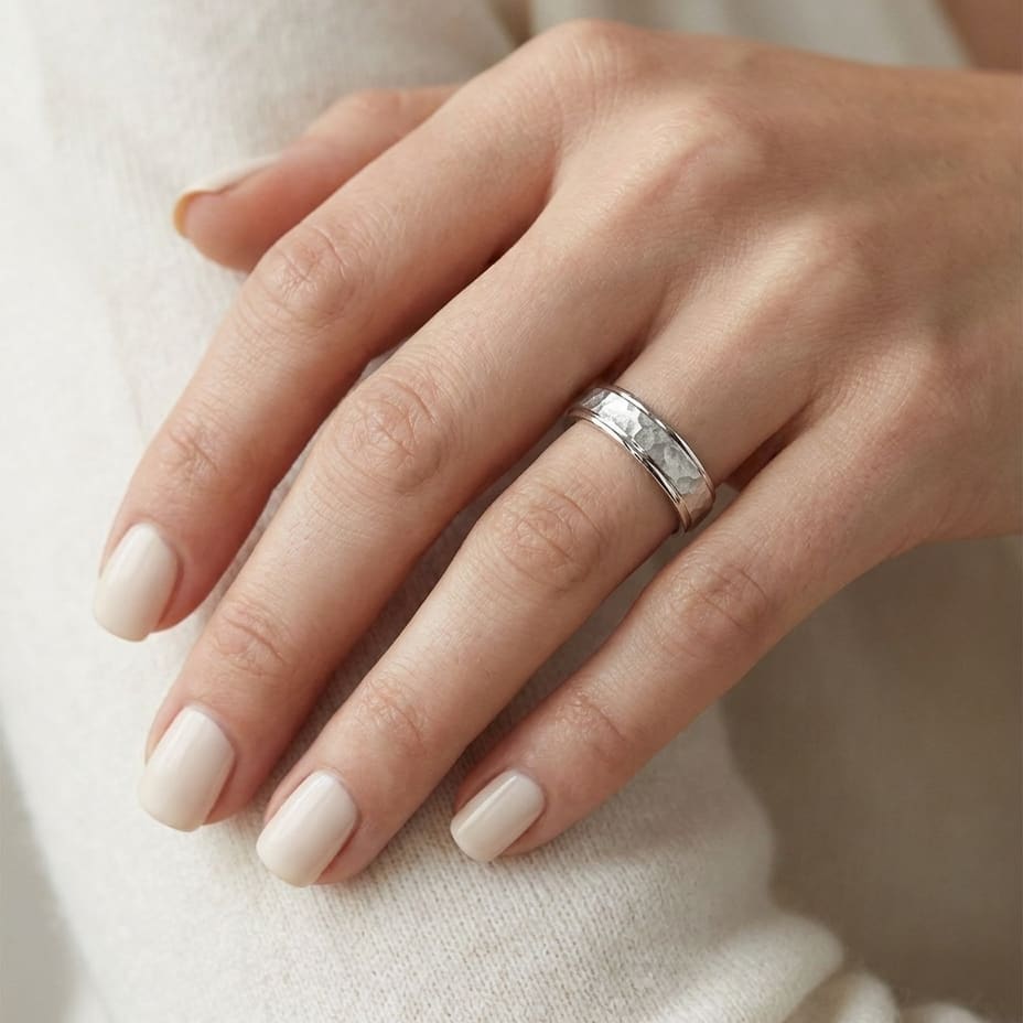 4mm Hammered Finish Carved Wedding Band in 14K White Gold, worn on hand, close-up