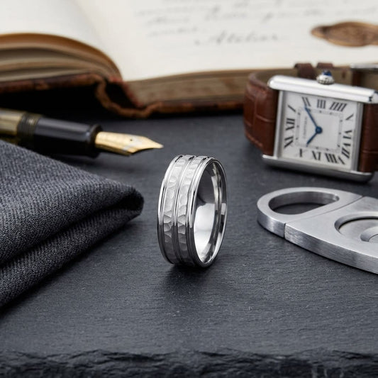 7.5mm High Polish Round Edge Carved Wedding Band in 14K White Gold, on walnut surface with pocket square