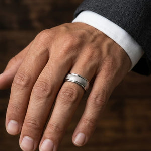 7mm Florentine Center High Polish Round Edge Carved Wedding Band in 14K White Gold, worn on hand, masculine close-up