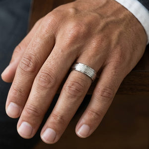 7.5mm Comfort-Fit Wedding Band in 14K White Gold, worn on hand, masculine close-up