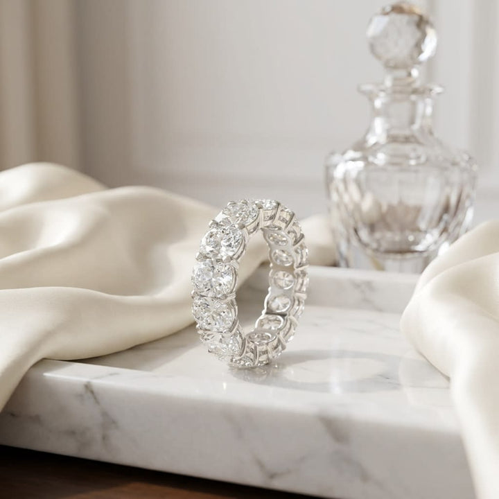 Elongated Cushion Lab Diamond Eternity Band, on marble vanity tray with silk
