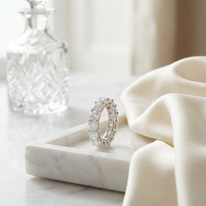 Cushion Cut Natural Diamond Eternity Band, on marble vanity tray with silk