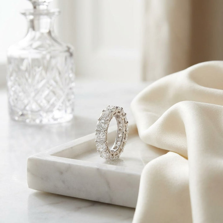 Cushion Cut Natural Diamond Eternity Band, on marble vanity tray with silk