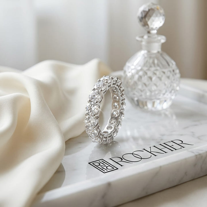Round Brilliant Natural Diamond Eternity Band, on marble vanity tray with silk