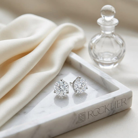 Martini Lab Diamond Stud Earrings | Round Brilliant, DEF VS Ideal Cut, IGI Certified, on marble vanity tray with silk