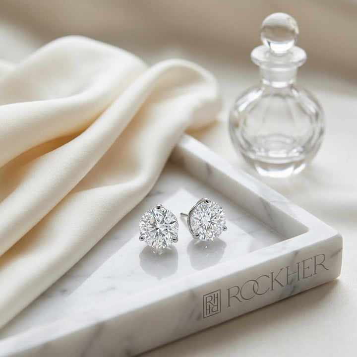 Martini Lab Diamond Stud Earrings | Round Brilliant, DEF VS Ideal Cut, IGI Certified, on marble vanity tray with silk