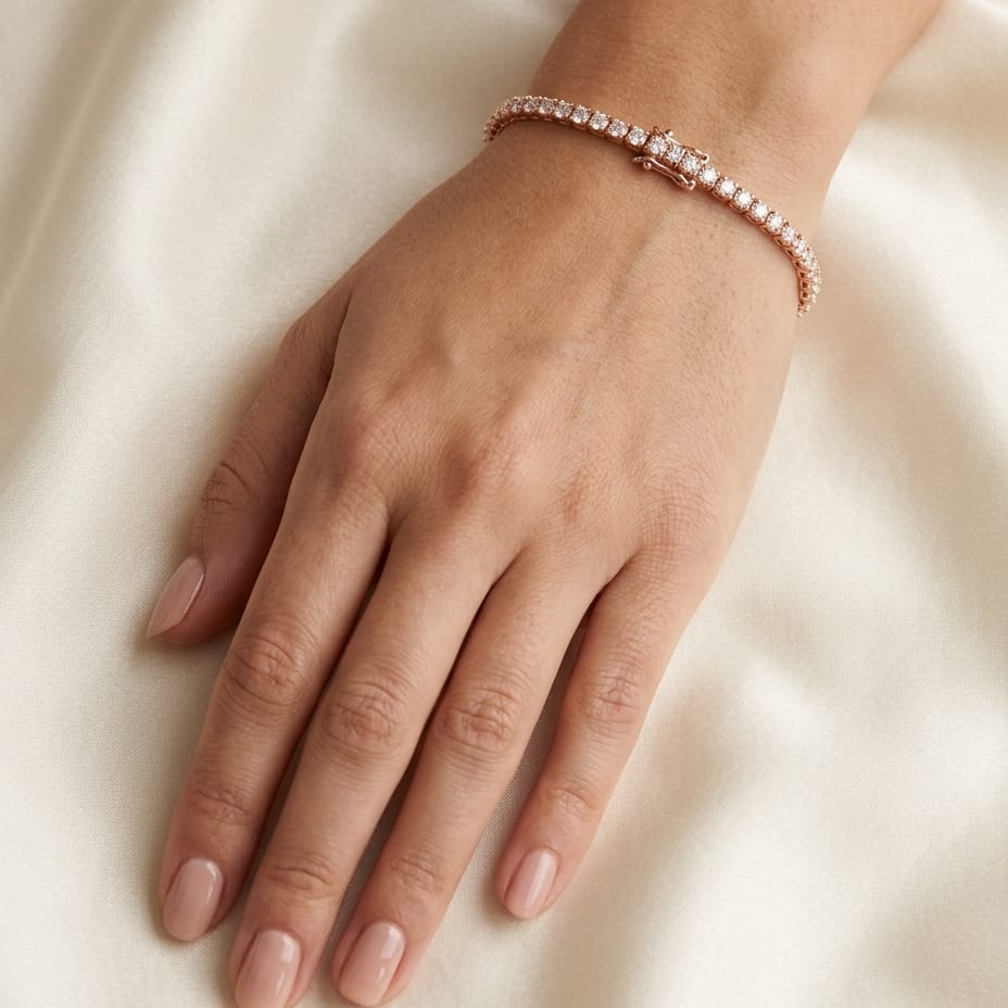 Diamond Round 4-prong Tennis Bracelet in 14K Yellow Gold, worn on hand, close-up