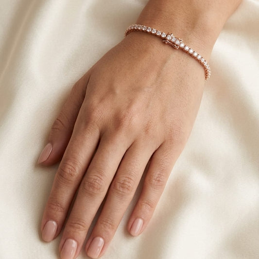 Diamond Round 4-prong Tennis Bracelet in 14K Yellow Gold, worn on hand, close-up