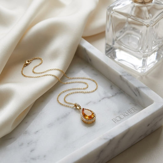 Citrine Pendant in 14K Yellow Gold, on marble vanity tray with silk