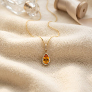 Citrine Pear & Diamond Halo Pendant in 14K Yellow Gold - flat lay