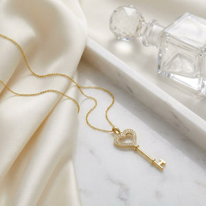 Natural Diamond Heart Shape Pendant in 14K Yellow Gold, 6 ct. t.w., on marble vanity tray with silk