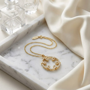 Natural Diamond Round Brilliant Pendant in 14K Yellow Gold, on marble vanity tray with silk
