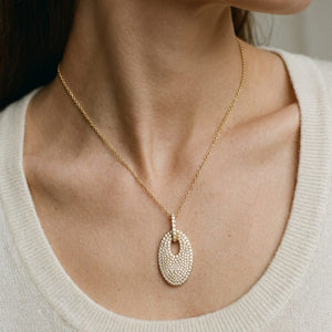 Natural Diamond Oval Pendant in 14K Yellow Gold, worn close-up portrait