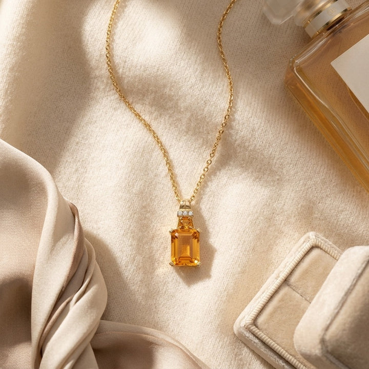 Citrine & Diamond Emerald Cut Pendant in 14K Yellow Gold - flat lay