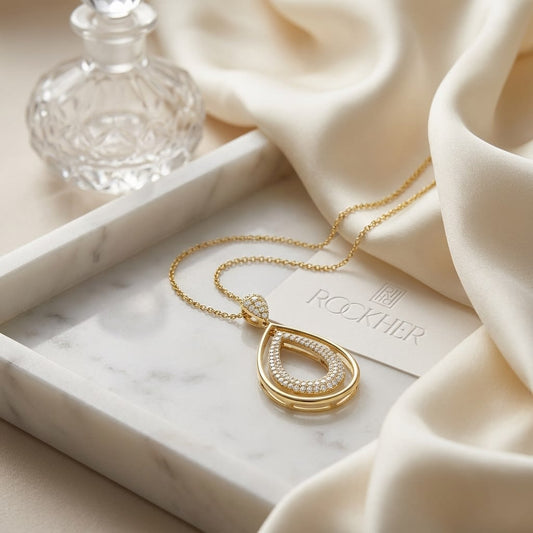 Natural Diamond Oval Pendant in 14K Yellow Gold, on marble vanity tray with silk
