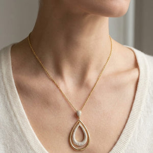 Natural Diamond Oval Pendant in 14K Yellow Gold, worn close-up portrait