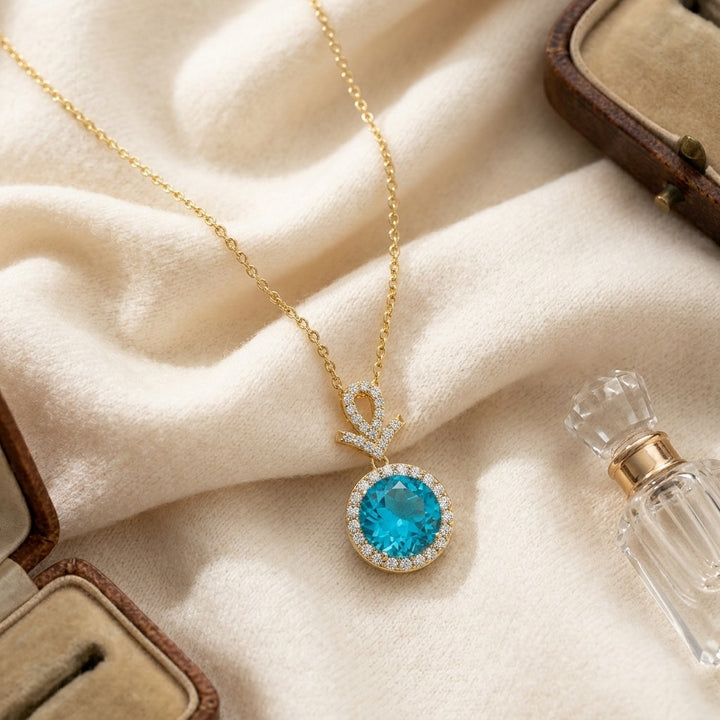 Blue Topaz & Diamond Pave Halo Pendant in 14K Yellow Gold - flat lay