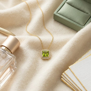 Peridot Cushion & Diamond Double Halo Pendant in 14K Yellow Gold - flat lay