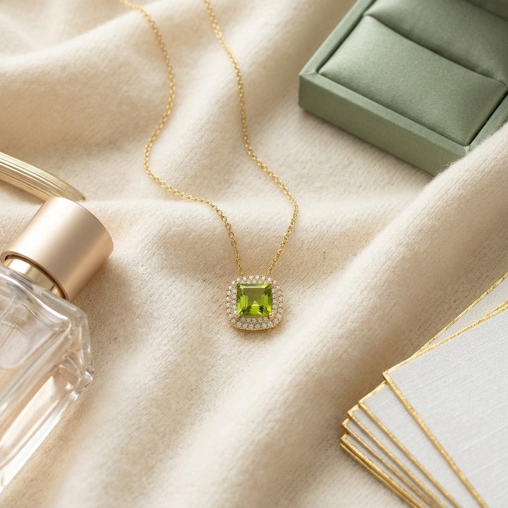 Peridot Cushion & Diamond Double Halo Pendant in 14K Yellow Gold - flat lay