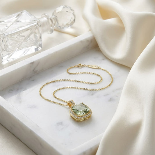 Green Quartz Cushion Halo Pendant in 14K Yellow Gold, on marble vanity tray with silk