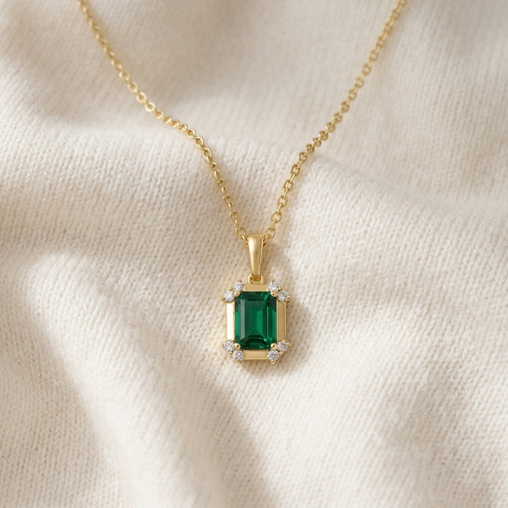 Created Emerald & Diamond Pendant 1/10ctw, 16-18 Adj Chain in 14K Yellow Gold - flat lay