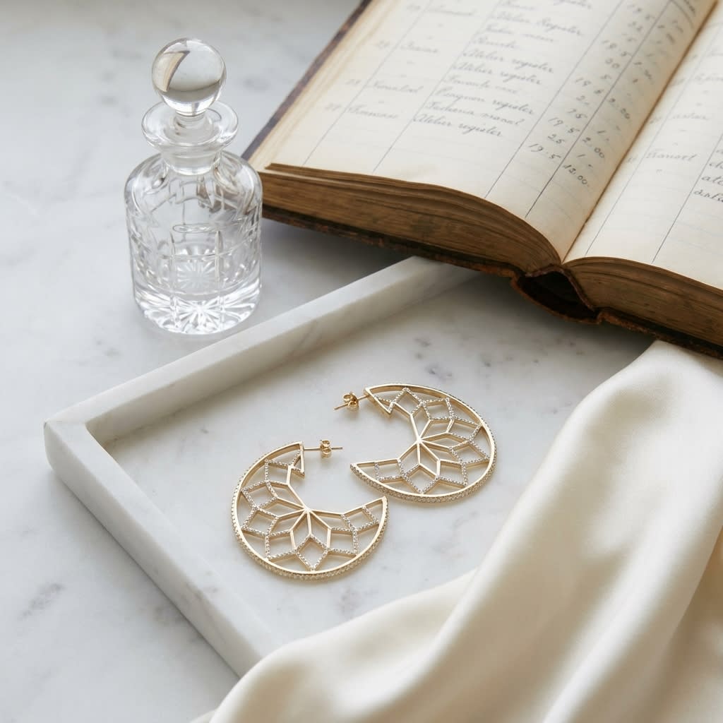 Diamond Snowflake Earrings in 14k Yellow Gold 0.33ctw, on marble vanity tray with silk